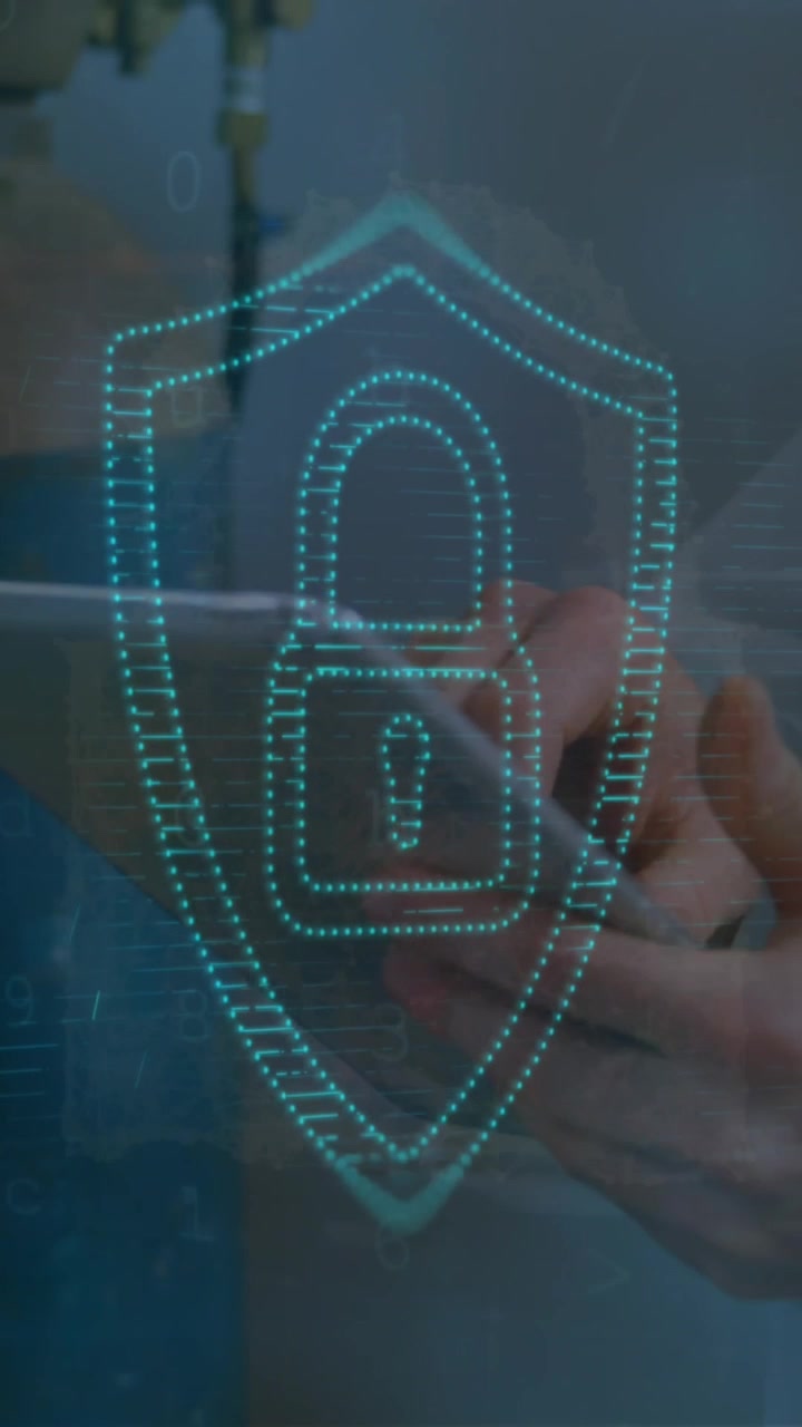 Animation of security padlock icon and light spot over caucasian male engineer using digital tablet