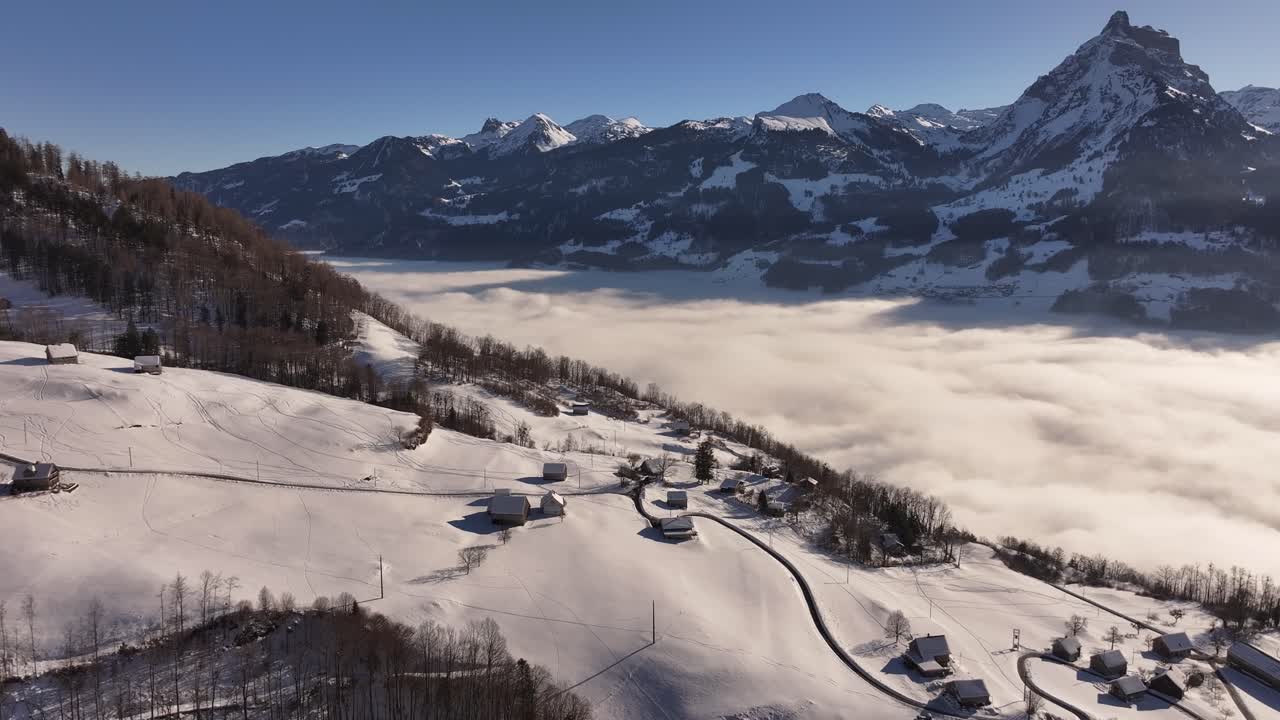The picturesque village of Amden, located in the canton of St. Gallen, Switzerland, surrounded by the majestic Swiss Alps.