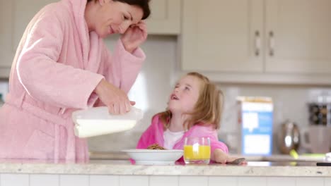 mother and daughter having breakfast