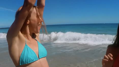 female friends having fun on beach