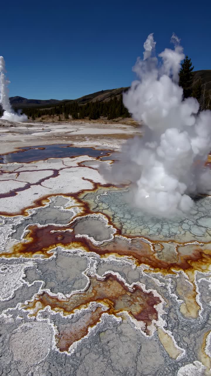 Aerial view of a geothermal landscape with vibrant mineral deposits and steam rising, perfect