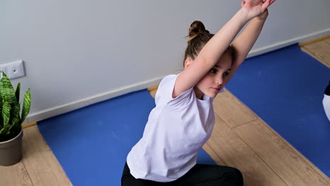 girls exercising in yoga class