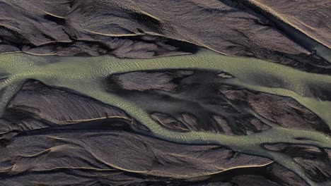 braided kudafljot river with lots of channels formed in the riverbed at daytime in south iceland