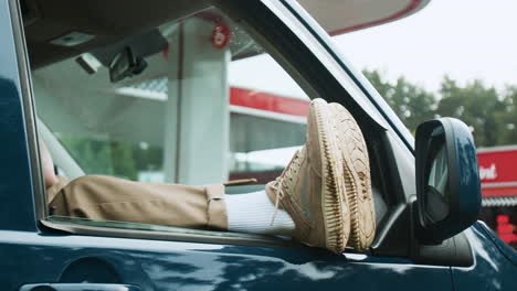 Man-resting-inside-of-a-van