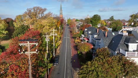 rising aerial of historic american town in autumn