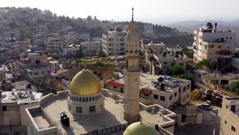 aerial view over golden dome mosque in palestine town biddu,near jerusalem