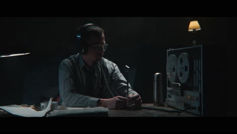 an intelligence officer is working at the wiretap station