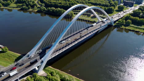 modern arch bridge over a river