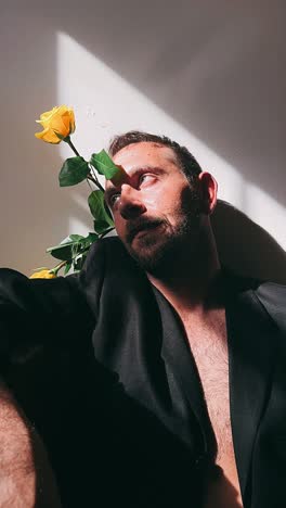 man with yellow roses in a black blazer