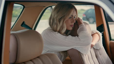 woman in a vintage car