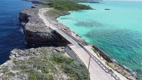 Cinematic-aerial-view-drone-shot-flying-over-glass-window-bridge-on-the-island-of-eleuthera-in-the-bahamas---separating-the-atlantic-ocean-from-the-caribbean-sea