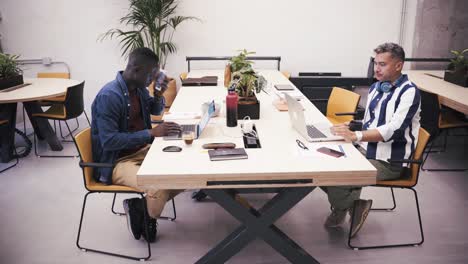 couple of coworkers working in the office