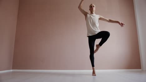 a young man dancing in a studio