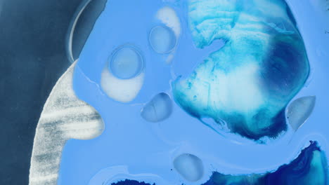 blue abstract art fluid effect with particles separating