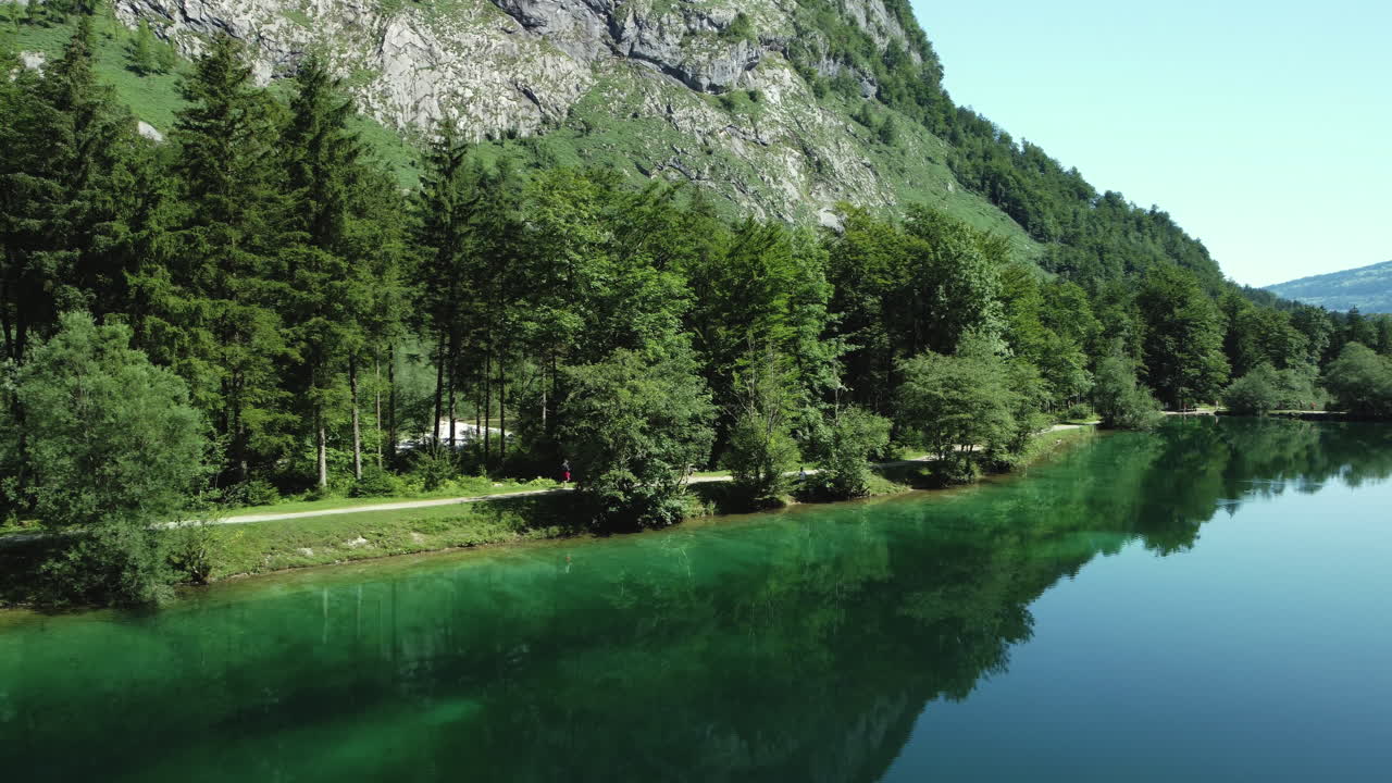 Serene Alpine Lake with Forest Path