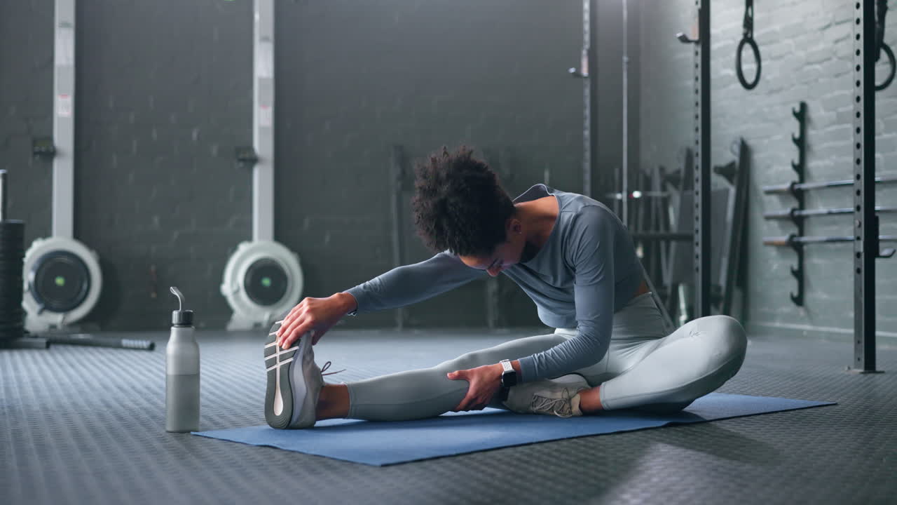 Black woman, gym and stretching