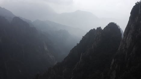 huangshan yellow mountain peaks in cloud cover, anhui province china, aerial view