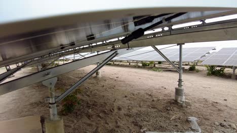 Close-up-tilt-of-solar-panel-bifacial-technology-installed-in-photovoltaic-farm,-modern-green-technology-for-renewable-energy---Gambia,-West-Africa