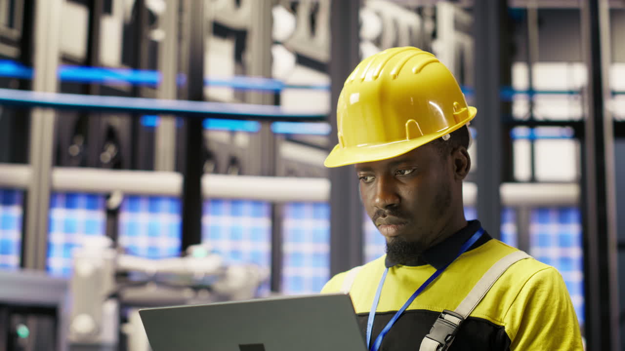 Vertical video Industry 4.0 plant engineer following maintenance procedures to mend bugs