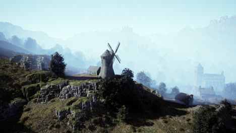 foggy village with windmill and distant church