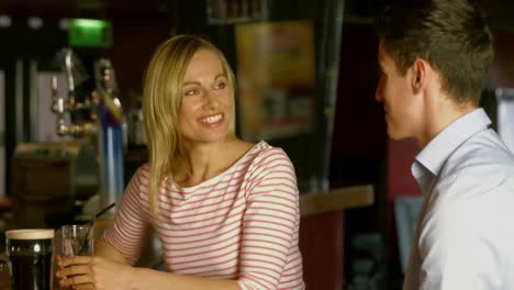 colleagues chatting at the bar together