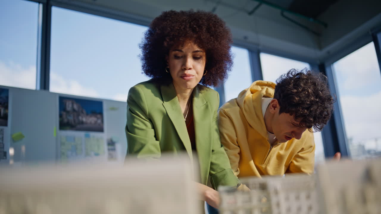 Frustrated designers reading laptop email worried architectural project failure
