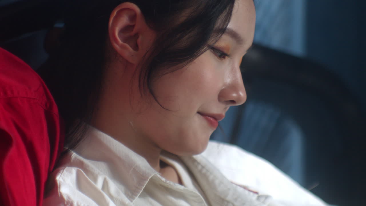 portrait of beautiful asiatic female model woman sitting with her boyfriend on bed room , happy couple close up