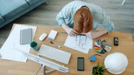 architect working on floor plans and design
