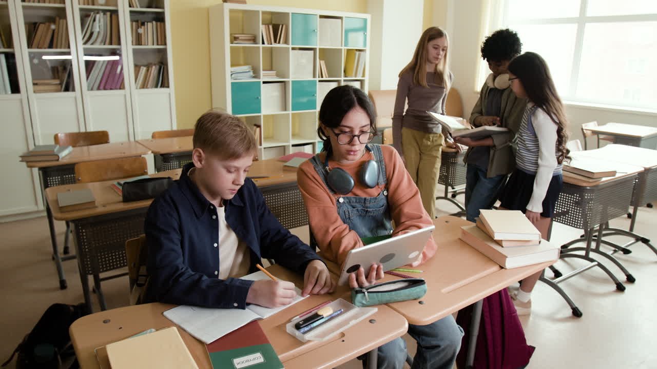 Students working and studying together in a diverse classroom setting
