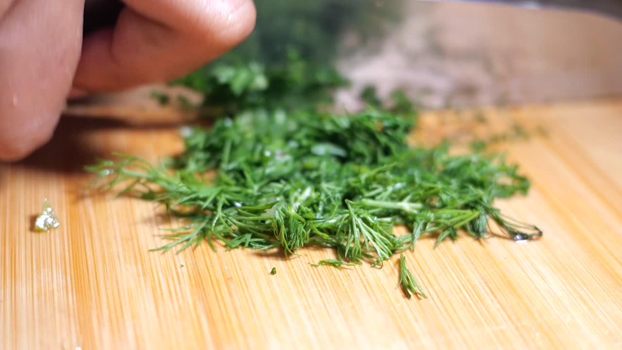 Chopped fresh dill on a cutting board