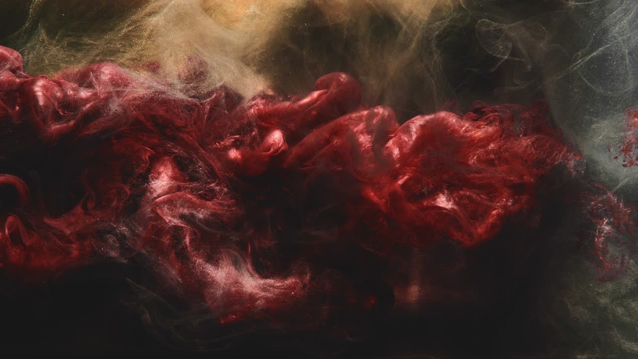 el logotipo del rastro de agua de tinta revela una nube de polvo de brillo rojo