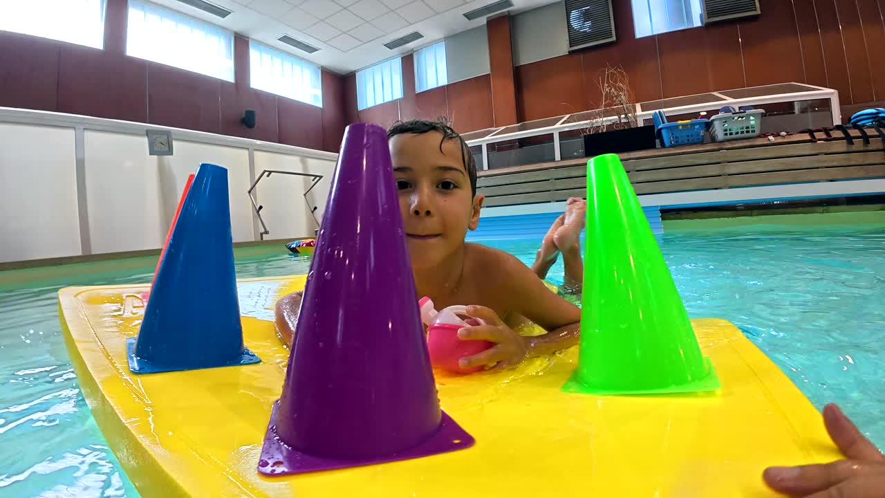 Boy playing in a swimming pool