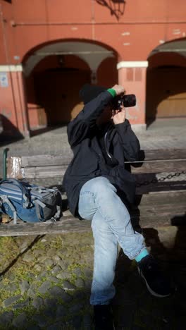 photographer taking picture in a city square