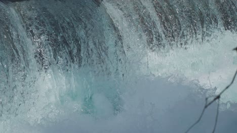 Close-up-shot-of-the-falling-water-along-rocky-slope-in-Norway-at-daytime