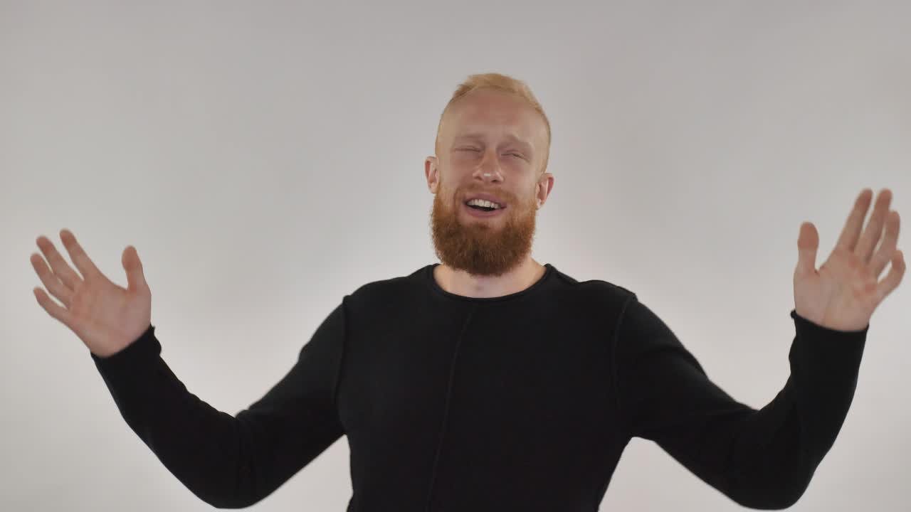 Redhead guy having fun, dancing in front of camera