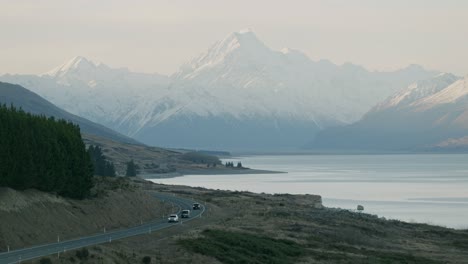 Static-shot-of-cars-driving-through-the-Mount-Cook-Valley-during-winter