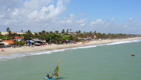 Aerial-vies-of-some-boats-browsing-by-the-sea,-Cumbuco,-Ceara,-Brazil