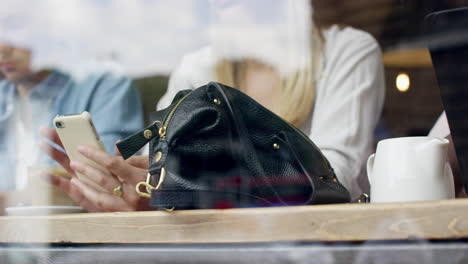 Close-up-hands-using-mobile-touchscreen-device