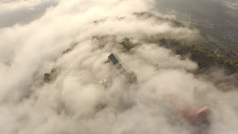 misty mountaintop structures