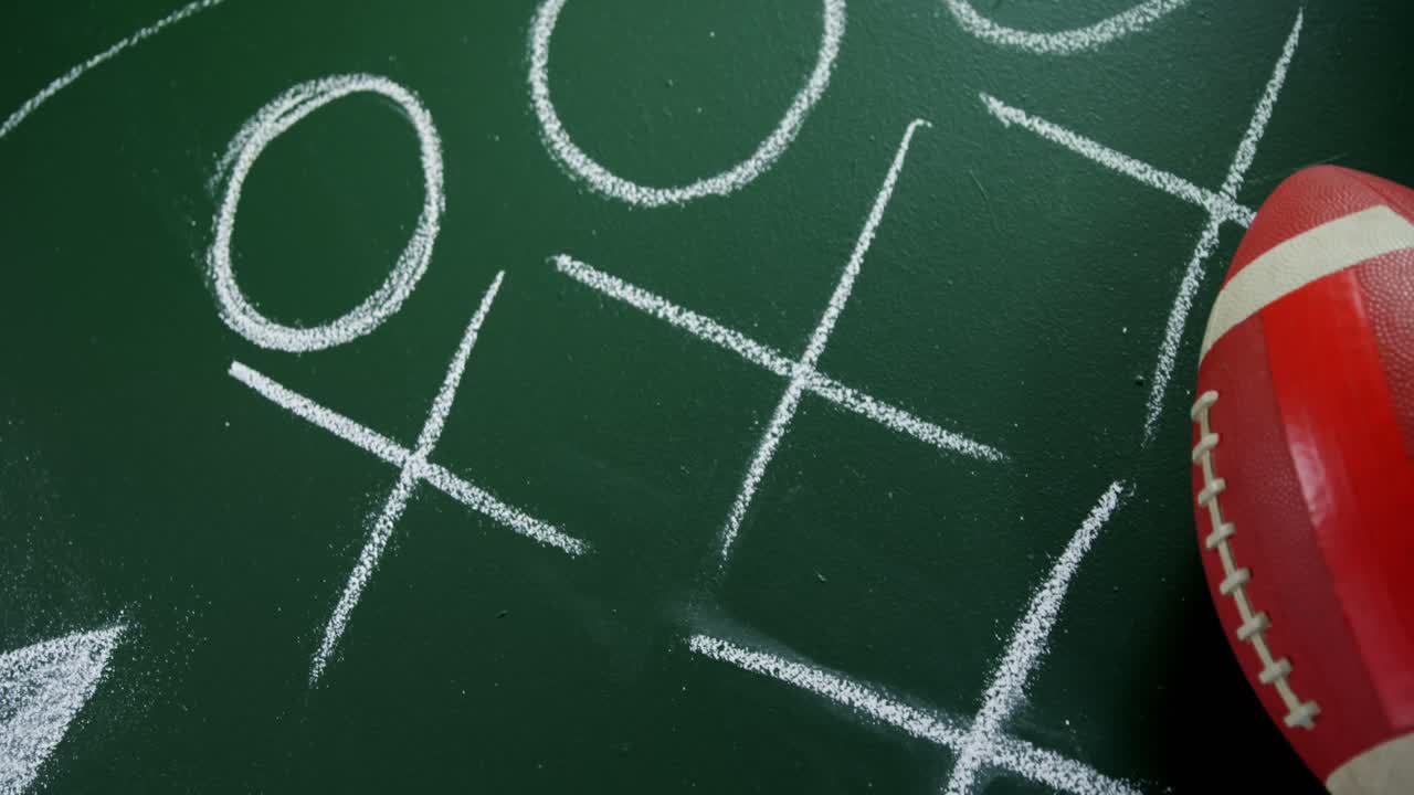 мяч для регби на стратегической доске 4k