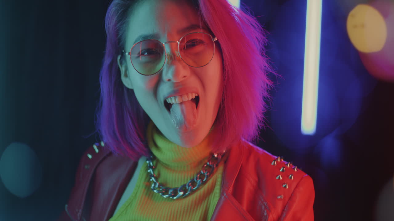 Stylish Young Woman in Neon Lights