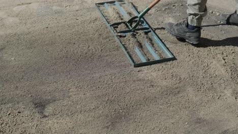 man laying sod grass in backyard garden for lawn installation and landscaping project, focused on home improvement and outdoor maintenance for a fresh, green lawn in a residential yard