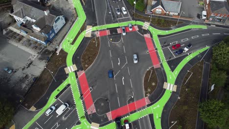 Aerial-view-vehicles-travelling-St-Helens-CYCLOPS-traffic-optimisation-junction-crossroad-intersection,-High-angle-view
