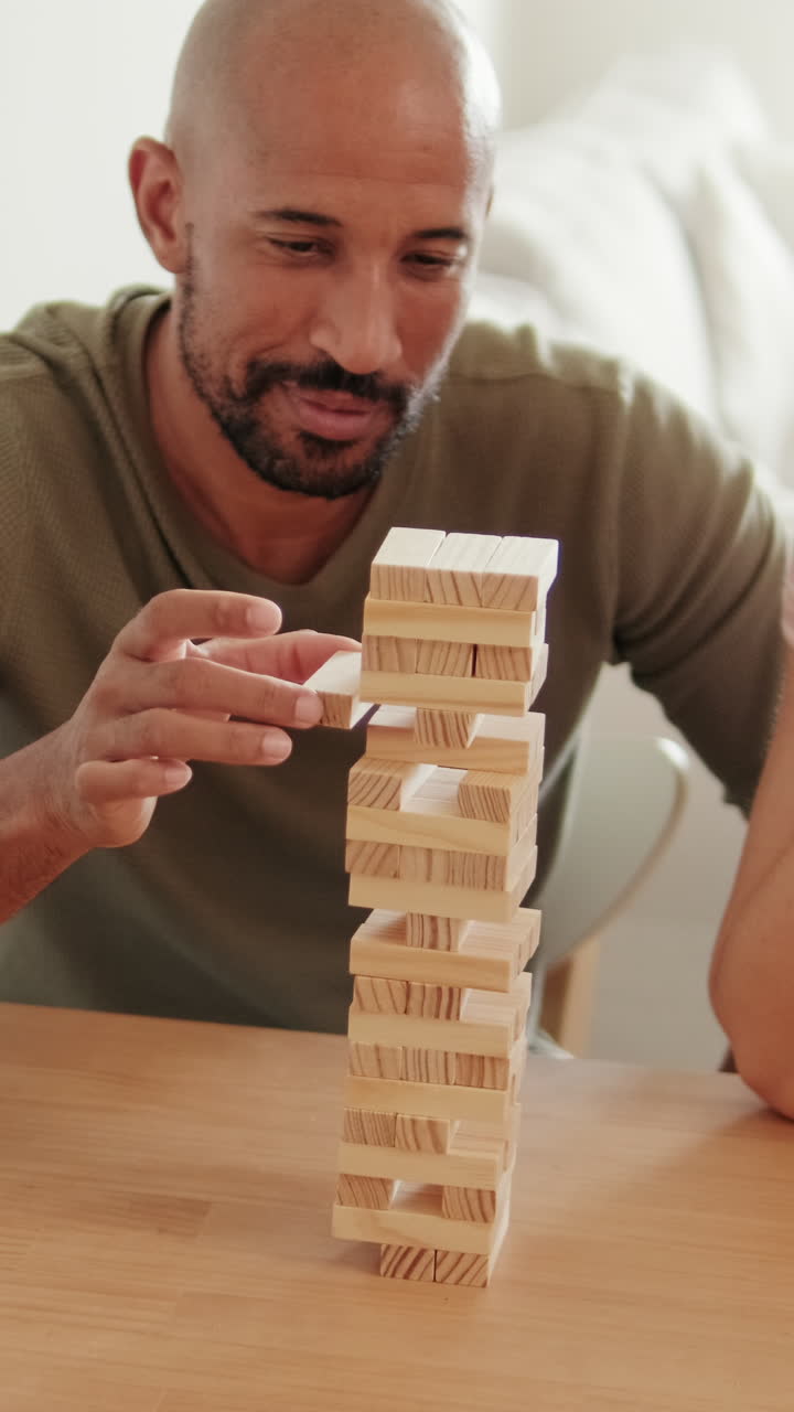 Couple Playing Jenga at Home