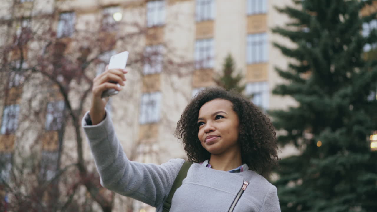 Woman Taking Selfie in the City