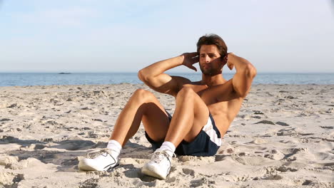 Shirtless-man-doing-sit-ups