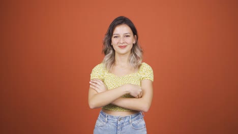 Young-woman-looking-at-camera-making-confidence-sign.