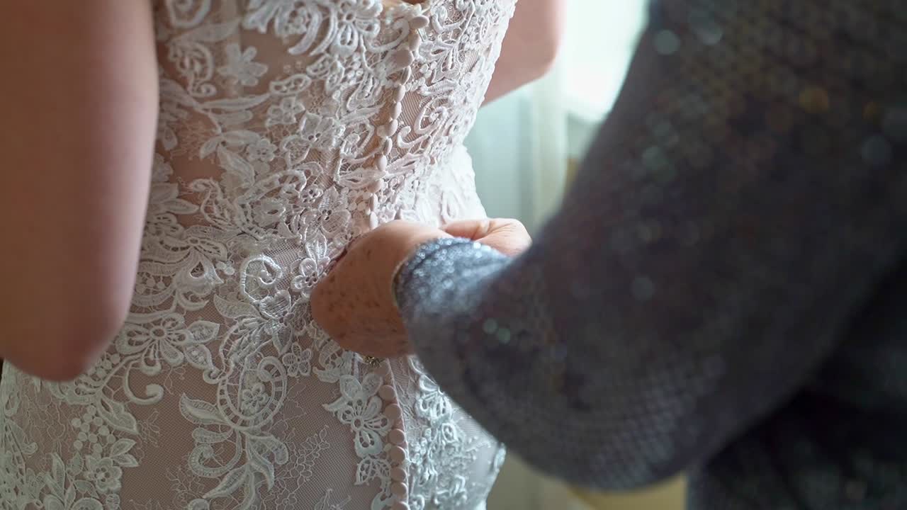 Woman Adjusting Bridge In Beautiful White Lace Dress On Wedding Day