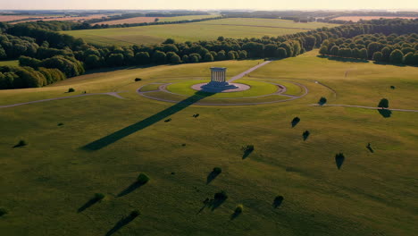 aerial view of a monument in a park at sunset