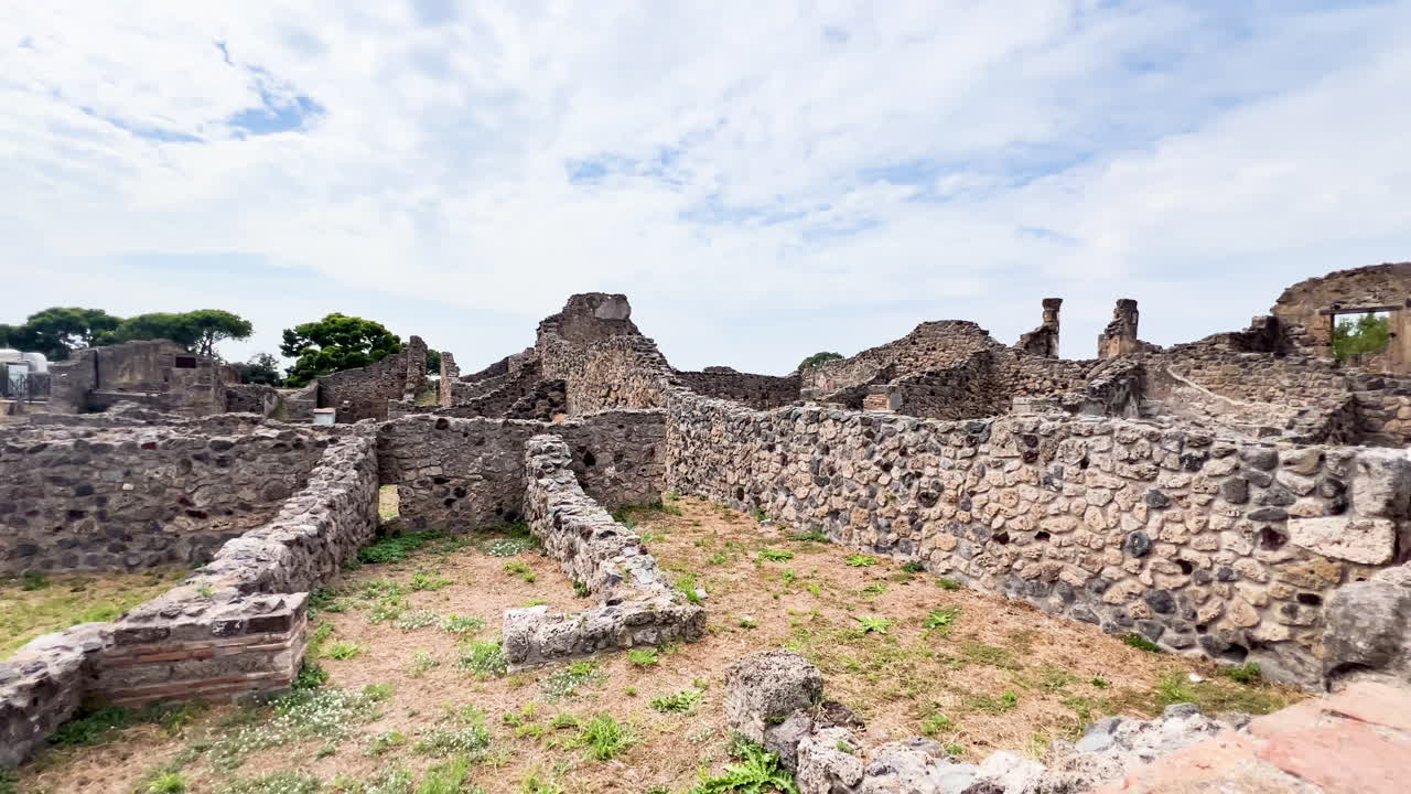 The ruins of Pompeii spread out under a dramatic sky, offering a poignant reminder of the city's tragic history and enduring legacy